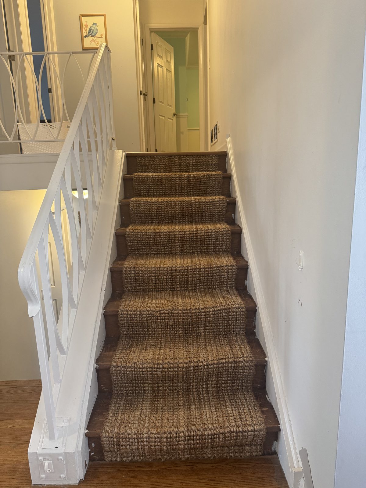 Formal dining room with chair-rail wainscoting, a brass chandelier, and a wall of sliding glass doors that open onto the back patio and fenced backyard.